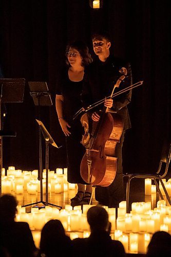 BROOK JONES / FREE PRESS
Elise Lavall&#xe9;e (left) on viloa and Samuel Nadurak on cello stand during the ovation from the crowd after performing A Tribute To Coldplay as part of the Fever Candlelight Series at the Winnipeg Art Gallery in Winnipeg, Man., Friday, Aug. 30, 2024. Musicians also performing from the Listeso Music Group while surrounded by candles on stage were Elation Pauls on violin and Chris Anstey on fiddle