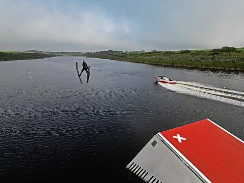 19082024
Ski jumper Casey Mommer soars through the air off a jump while training on a tiny, narrow, secluded lake on the Manitoba prairie in August for the World Over-35 Waterski Championships in Spain. Mommer has been competing in world-class waterski events for most of his life and placed second in ski jumping at the 2022 World Over-35 Waterski Championships in France and third at the 2018 World Over-35 Waterski Championships in Chile.
(Tim Smith/The Brandon Sun)