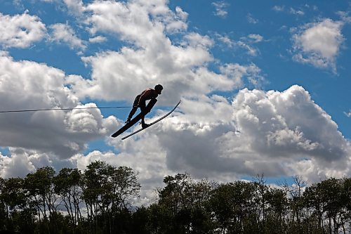 09082024
Ski jumper Casey Mommer presses while jumping during a training session in early August in advance of the World Over-35 Waterski Championships in Spain. Mommer has been jumping as much as possible this summer, when the wind is right. Most sessions consist of two sets of three or four jumps, which is about as much as Mommer&#x2019;s feet can take in the incredibly tight bindings. 
(Tim Smith/The Brandon Sun)