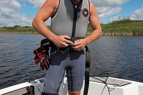 09082024
Casey Mommer gears up for a ski jumping training session on a tiny, secluded lake on the Manitoba prairie in early August ahead of the World Over-35 Waterski Championships in Spain.
(Tim Smith/The Brandon Sun)