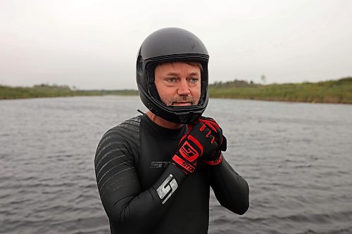 29082024
Casey Mommer secures his helmet while gearing up for a ski jumping training session on a tiny secluded lake on the Manitoba prairie in August ahead of the World Over-35 Waterski Championships in Spain.
(Tim Smith/The Brandon Sun)