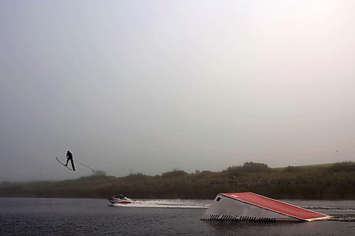 23082024
Casey Mommer takes a jump while training on a foggy morning in August, ahead of the World Over-35 Waterski Championships in Spain.  (Tim Smith/The Brandon Sun)