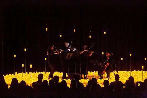 BROOK JONES / FREE PRESS
Musicians from the Listeso Music Group which include (clockwise from far left) Elation Pauls on violin, Chris Anstey on fiddle, Elise Lavall&#xe9;e on viloa and Samuel Nadurak on cello perform on stage as they are surrounded by candles during A Tribute To Coldplay as part of the Fever Candlelight Series at the Winnipeg Art Gallery in Winnipeg, Man., Friday, Aug. 30, 2024.