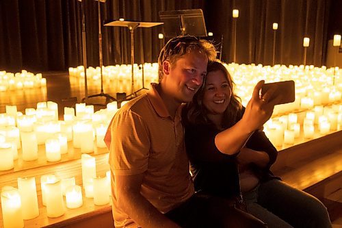 BROOK JONES / FREE PRESS
Vanessa LaCoste (right) takes a selfie with her boyfriend Kris Bulat after watching A Tribute To Coldplay as part of the Fever Candlelight Series at the Winnipeg Art Gallery in Winnipeg, Man., Friday, Aug. 30, 2024. Musicians from the Listeso Music Group which included Elation Pauls on violin, Chris Anstey on fiddle, Elise Lavall&#xe9;e on viloa and Samuel Nadurak on cello were surrounded by candles on stage as they performed 11 songs during a 65 minute program.