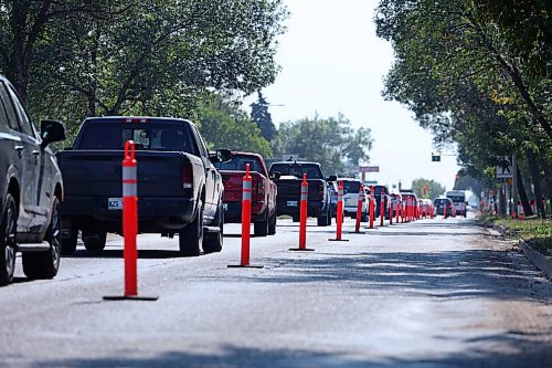 Bright orange pylons force southbound traffic along 18th Street into a single lane outside Brandon University on Tuesday afternoon. (Matt Goerzen/The Brandon Sun)