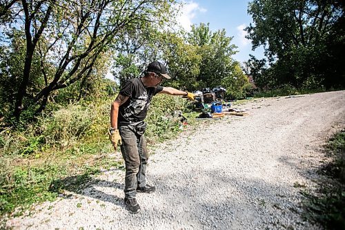 MIKAELA MACKENZIE / WINNIPEG FREE PRESS

Encampment resident Terry Johnsen points out where the police car hit the woman, who later died from her injuries, at Fort Rouge Park on Tuesday, Sept. 3, 2024. 

For Nicole story.
Winnipeg Free Press 2024