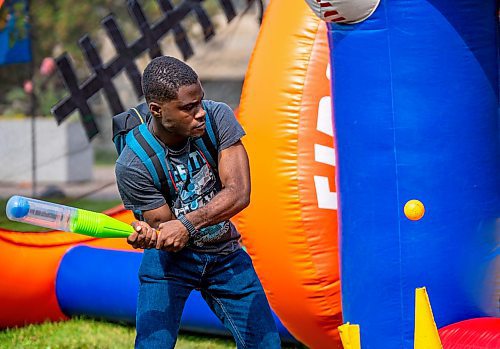 NIC ADAM / FREE PRESS
First year student Kai Ochei plays an inflatable baseball game at UofM during their fall orientation Tuesday.
240903 - Tuesday, September 03, 2024.

Reporter:?