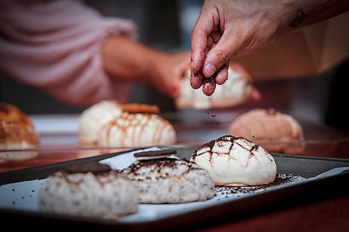 JOHN WOODS / WINNIPEG FREE PRESS
Dylan Gomez, his partner Rydell Enns, and his mother Liliana make some conchas in their kitchen in Winnipeg Tuesday, September 3, 2024. Gomez who learnt how to make the latin american sweet bread breakfast treat from his grandmother and mother sells the creations through his company Concha Craze.

Re: dave