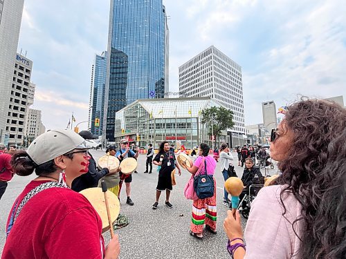 Protesters gather at Portage and Main on Wednesday. (Nic Adam / Free Press)
