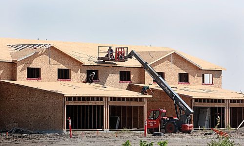 A construction crew works on a new residential development on First Street near Crocus Plains Regional Secondary School on Wednesday afternoon. (Matt Goerzen/The Brandon Sun)