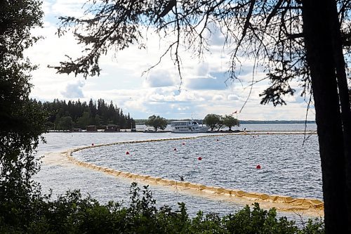 09082024
The containment curtain set up to prevent the spread of zebra mussels in Clear Lake in Riding Mountain National Park is seen Friday along with the Martese cruise boat at the marina, which is currently docked for the season as part of ongoing zebra mussel mitigation. 
(Tim Smith/The Brandon Sun)