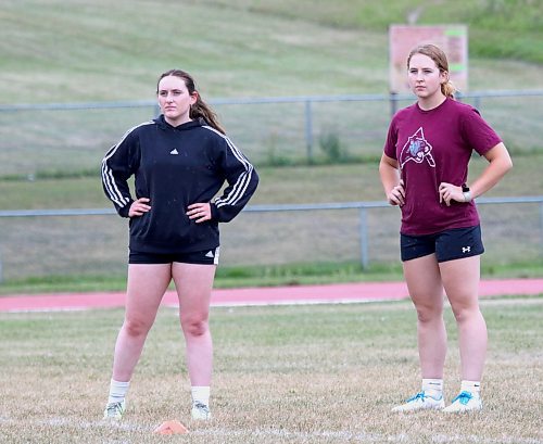 Katie Avison, left, Megan Beswitherick and the Assiniboine College Cougars open the MCAC women's soccer season at their home Sportsplex field today. (Thomas Friesen/The Brandon Sun)