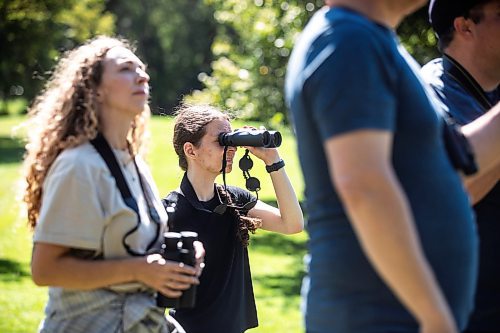 MIKAELA MACKENZIE / WINNIPEG FREE PRESS

Karalee Reimer looks through her binoculars during the University of Manitoba Indigenous Birding Club&#x573; weekly birding walk on Friday, Aug. 30, 2024. 

For Eva story.
Winnipeg Free Press 2024