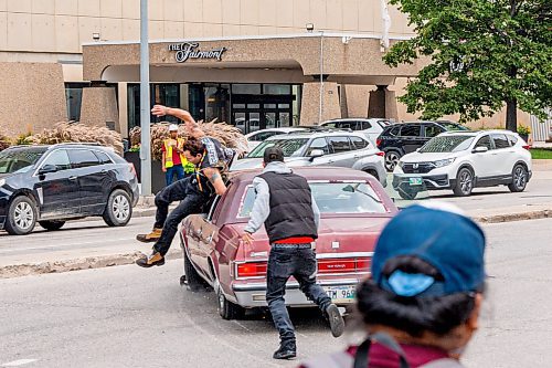 NIC ADAM / FREE PRESS
A man drove his vehicle through the protest blocking traffic at Portage and Main on Wednesday about 20 minutes after it began, striking a protester and dragging her bike under his car.
240904 - Wednesday, September 04, 2024.

Reporter: Nicole
