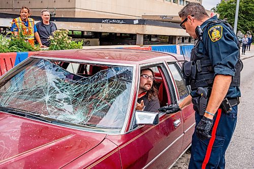 NIC ADAM / FREE PRESS
A man drove his vehicle through the protest blocking traffic at Portage and Main on Wednesday about 20 minutes after it began, striking a protester and dragging her bike under his car.
240904 - Wednesday, September 04, 2024.

Reporter: Nicole
