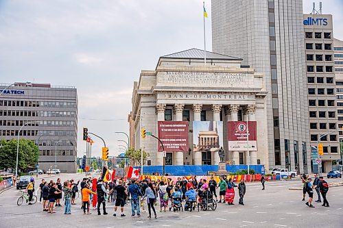 NIC ADAM / FREE PRESS
About 50 people shut down the intersection at Portage and Main early Wednesday afternoon after Tammy Bateman, an Indigenous woman, was struck and killed by a police vehicle at a homeless encampment.
240904 - Wednesday, September 04, 2024.

Reporter: Nicole