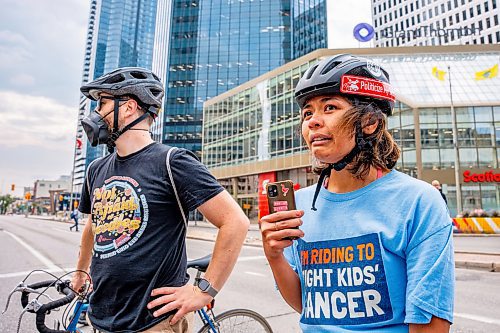 NIC ADAM / FREE PRESS
A protester and Critical Mass Winnipeg member was struck with her bike when a man drove his vehicle through the protest blocking traffic at Portage and Main on Wednesday about 20 minutes after it began.
240904 - Wednesday, September 04, 2024.

Reporter: Nicole
