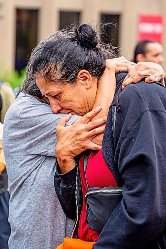 NIC ADAM / FREE PRESS
A protester comforts Lori Bateman, sister of Tammy Bateman the Indigenous woman who was struck and killed by a police vehicle at a homeless encampment, speaks to press at the protest involving about 50 people who shut down the intersection at Portage and Main early Wednesday afternoon.
240904 - Wednesday, September 04, 2024.

Reporter: Nicole