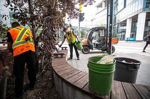 MIKAELA MACKENZIE / WINNIPEG FREE PRESS

Downtown Winnipeg BIZ Enviro Team members Jeremy Roulette (left) and Jim Main clean trash up at the corner of Carlton and Graham on Wednesday, Sept. 4, 2024. 

For Malak story.
Winnipeg Free Press 2024