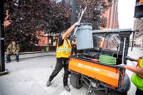 MIKAELA MACKENZIE / WINNIPEG FREE PRESS

Downtown Winnipeg BIZ Enviro Team members Jeremy Roulette (left) and Jim Main clean trash up at the corner of Carlton and Graham on Wednesday, Sept. 4, 2024. 

For Malak story.
Winnipeg Free Press 2024