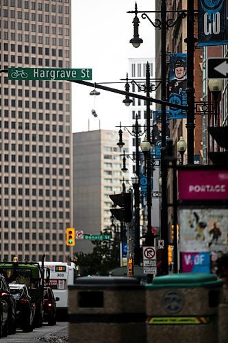 MIKAELA MACKENZIE / WINNIPEG FREE PRESS

Shoes hand from a light standard on Hargrave Street at Portage Avenue on Wednesday, Sept. 4, 2024. 

For Malak story.
Winnipeg Free Press 2024