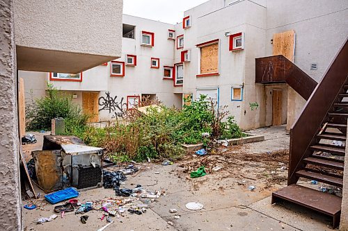 NIC ADAM / FREE PRESS
Centre Village, an inner-city subsidized housing complex once lauded for its design that was left to rot and became a hub for criminal activity, caught fire Wednesday night amid concerns about squatters and criminal activity there. We have a photo of police taking away a woman from the scene. Neighbouring residents have long been concerned. In May, Manitoba Housing donated the site to the Winnipeg Housing Rehabilitation Corp., a non-profit organization founded in the late 1970s to develop affordable housing. The May announcement was supposed to be held in April, but it was delayed after a body was found at the site (wasn&#x2019;t deemed criminal at the time but we&#x2019;ll check again). Reaching out to the province, neighbours/area biz/organizations, area city councillor and police. Is this what happens when a building is left to sit vacant for too long? 
240905 - Thursday, September 05, 2024.

Reporter: Malak