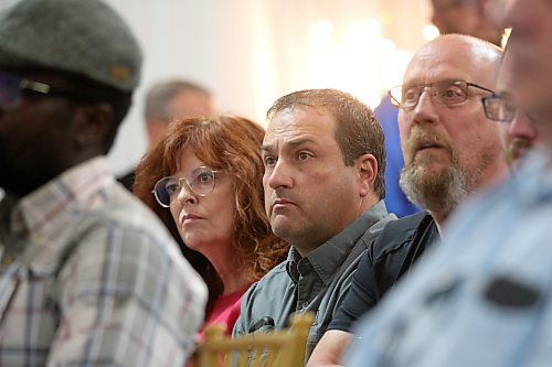 Councillors Heather Karrouzze and Jason Splett (Ward 8) listen to Brandon Mayor Jeff Fawcett answer a question from the audience during a public town hall late Thursday at The Backyard on Aberdeen. (Matt Goerzen/The Brandon Sun)