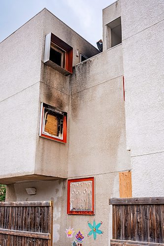 NIC ADAM / FREE PRESS
Smoke and soot mark the walls at Centre Village, an inner-city subsidized housing complex once lauded for its design that was left to rot and became a hub for criminal activity, after it caught fire Wednesday night amid concerns about squatters and criminal activity there. 
240905 - Thursday, September 05, 2024.

Reporter: Malak