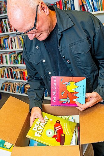 NIC ADAM / FREE PRESS
JHS executive director Aiden Enns rifles through a box of children&#x2019;s books for the JHS recorded stories program.
240905 - Thursday, September 05, 2024.

Reporter: Ben Waldman