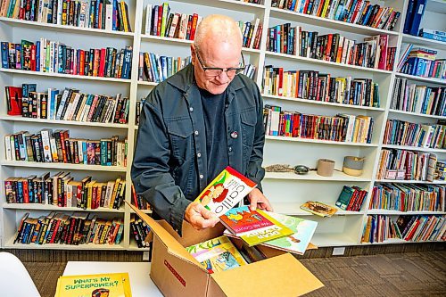 NIC ADAM / FREE PRESS
JHS executive director Aiden Enns rifles through a box of children&#x2019;s books for the JHS recorded stories program.
240905 - Thursday, September 05, 2024.

Reporter: Ben Waldman