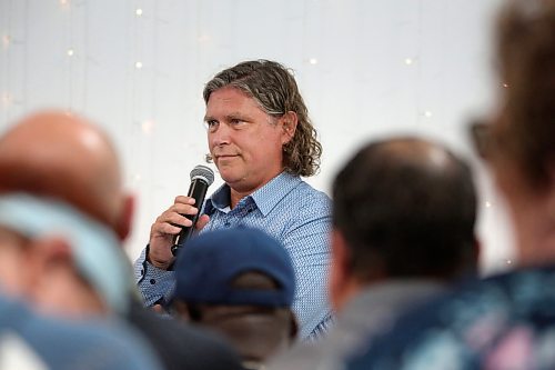 Brandon Mayor Jeff Fawcett listens to a question from the audience during a public townhall meeting he held with Brandon East NDP MLA Glen Simard late Thursday at The Backyard on Aberdeen. (Matt Goerzen/The Brandon Sun)