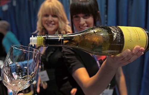 JOE.BRYKSA@FREEPRESS.MB.CA Local-(See   standup photo)-     Kriata Lemoine, left, and Gabrielle Douchant pour some Wolf Blass Chardonnay at the 9th annual Winnipeg Wine Festival featuring 32 Austrialian Wine makers- The Festival runs at the Winnipeg Convention Center until May 01, 2010  - Proceeds from the event at for Special oympics Manitoba- JOE BRYKSA/WINNIPEG FREE PRESS- Apr 30, 2010