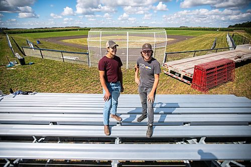 Jace Guilford (left) and Joe Gardiner at the Field of Dreams baseball diamond near Clearwater, Manitoba on Thursday. (Photos by Mikaela MacKenzie/Winnipeg Free Press)