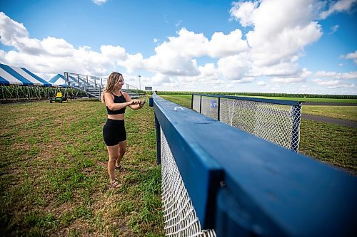 MIKAELA MACKENZIE / WINNIPEG FREE PRESS

Melanie Matsyk-Gardiner touches up the paint on the fences at the Field of Dreams baseball diamond near Clearwater, Manitoba on Thursday, Sept. 5, 2024. 

For Mike McIntyre story.
Winnipeg Free Press 2024