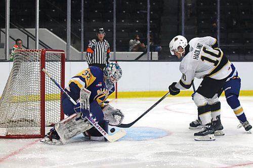 Brandon Wheat Kings forward Caleb Hadland (10) bats a rebound at Saskatoon Blades goalie Logan Cunningham during Western Hockey League preseason action at Westoba Place on Friday evening. (Perry Bergson/The Brandon Sun)