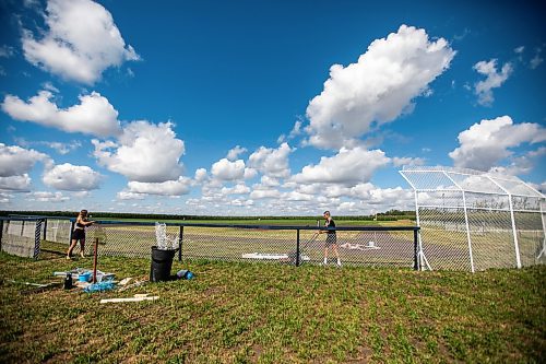 MIKAELA MACKENZIE / WINNIPEG FREE PRESS

Melanie Matsyk-Gardiner (left) and Claire McKay work on preparing the Field of Dreams baseball diamond near Clearwater, Manitoba on Thursday, Sept. 5, 2024. 

For Mike McIntyre story.
Winnipeg Free Press 2024