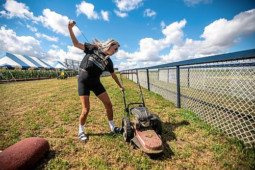 MIKAELA MACKENZIE / WINNIPEG FREE PRESS

Claire McKay starts the trimmer up at the Field of Dreams baseball diamond near Clearwater, Manitoba on Thursday, Sept. 5, 2024. 

For Mike McIntyre story.
Winnipeg Free Press 2024