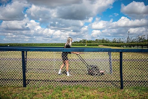 MIKAELA MACKENZIE / WINNIPEG FREE PRESS

Claire McKay trims the grass at the edges of the Field of Dreams baseball diamond near Clearwater, Manitoba on Thursday, Sept. 5, 2024. 

For Mike McIntyre story.
Winnipeg Free Press 2024