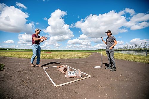 MIKAELA MACKENZIE / WINNIPEG FREE PRESS

Jace Guilford (left) and Joe Gardiner talk about the work that went into creating the Field of Dreams baseball diamond near Clearwater, Manitoba on Thursday, Sept. 5, 2024. 

For Mike McIntyre story.
Winnipeg Free Press 2024