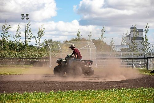 MIKAELA MACKENZIE / WINNIPEG FREE PRESS

Jace Guilford drags the infield at the Field of Dreams baseball diamond near Clearwater, Manitoba on Thursday, Sept. 5, 2024. 

For Mike McIntyre story.
Winnipeg Free Press 2024