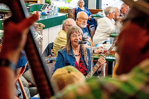 NIC ADAM / FREE PRESS
Debbie Tonner plays her banjo at lively bluegrass jam Friday morning in the Lake Trail Family Restaurant in Anola, MB.
240906 - Friday, September 06, 2024.

Reporter: ?