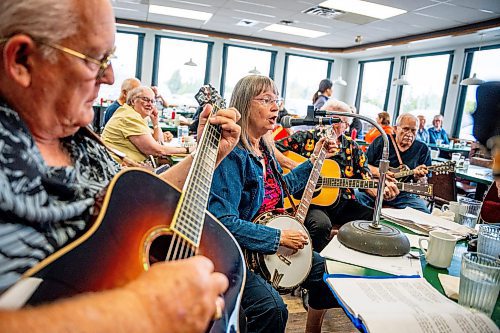 NIC ADAM / FREE PRESS
Debbie Tonner plays her banjo at lively bluegrass jam Friday morning in the Lake Trail Family Restaurant in Anola, MB.
240906 - Friday, September 06, 2024.

Reporter: ?