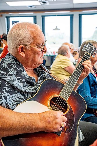 NIC ADAM / FREE PRESS
Harry McKay plays his guitar at lively bluegrass jam Friday morning in the Lake Trail Family Restaurant in Anola, MB.
240906 - Friday, September 06, 2024.

Reporter: ?