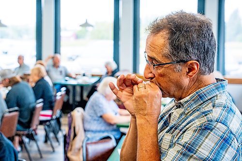 NIC ADAM / FREE PRESS
Mike Mitchell, from Victoria BC, plays the Harmonica at a lively bluegrass jam Friday morning in the Lake Trail Family Restaurant in Anola, MB.
240906 - Friday, September 06, 2024.

Reporter: ?