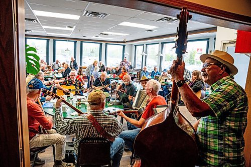 NIC ADAM / FREE PRESS
Don Wiebe, Angie Smith, Kaj Aslak, Frank Epp, David Evans, Peter Doerksen, Murray Leonard, Paul Picard, Debbie Toner, Ken Forbister (from right)
A group of seniors have been holding a lively bluegrass jam every Friday morning in Anola, for close to 25 years. The group - as many as 15 - gather for breakfast at 9 a.m., then start tuning up their instruments - guitar, banjo, mandolin, stand-up bass - around 9:30. 
240906 - Friday, September 06, 2024.

Reporter: ?