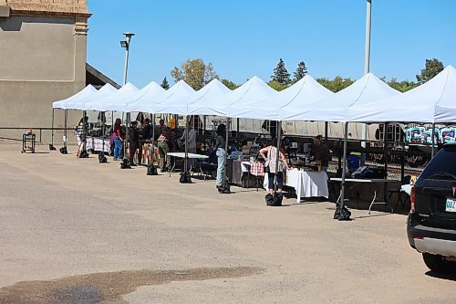 Patrons and vendors at the Downtown Summer Market Friday afternoon. (Abiola Odutola/The Brandon Sun)