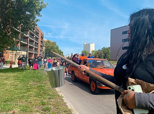 Maggie Macintosh / Free Press
Jasmine Brine, a coordinator at the Spence Neighbourhood Association, was among those who carried smudge buckets during the West End parade on Saturday.