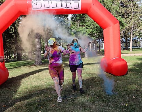 Runners at the 5th annual MADD Strides for Change walk/run get blasted with powdered dye on Saturday evening. (Photos by Geena Mortfield/The Brandon Sun)