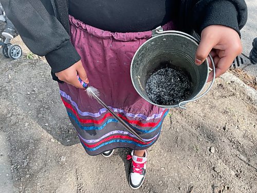 Maggie Macintosh / Free Press
Marisska Paul, 19, said it was an honour to hold a smudging bucket during the inaugural West End "Smudge our Streets" event on Saturday. 
