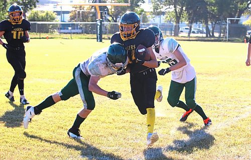 Neelin Spartans Ethan Olson (2) delivers a punishing hit to Neepawa Tigers running back Dylan Barnstable (14) as Neelin's Devin Lucas and Neepawa's Rhys Fraser (10) look on during Rural Manitoba Football League action on Sunday afternoon. (Perry Bergson/The Brandon Sun)
Sept. 8, 2024